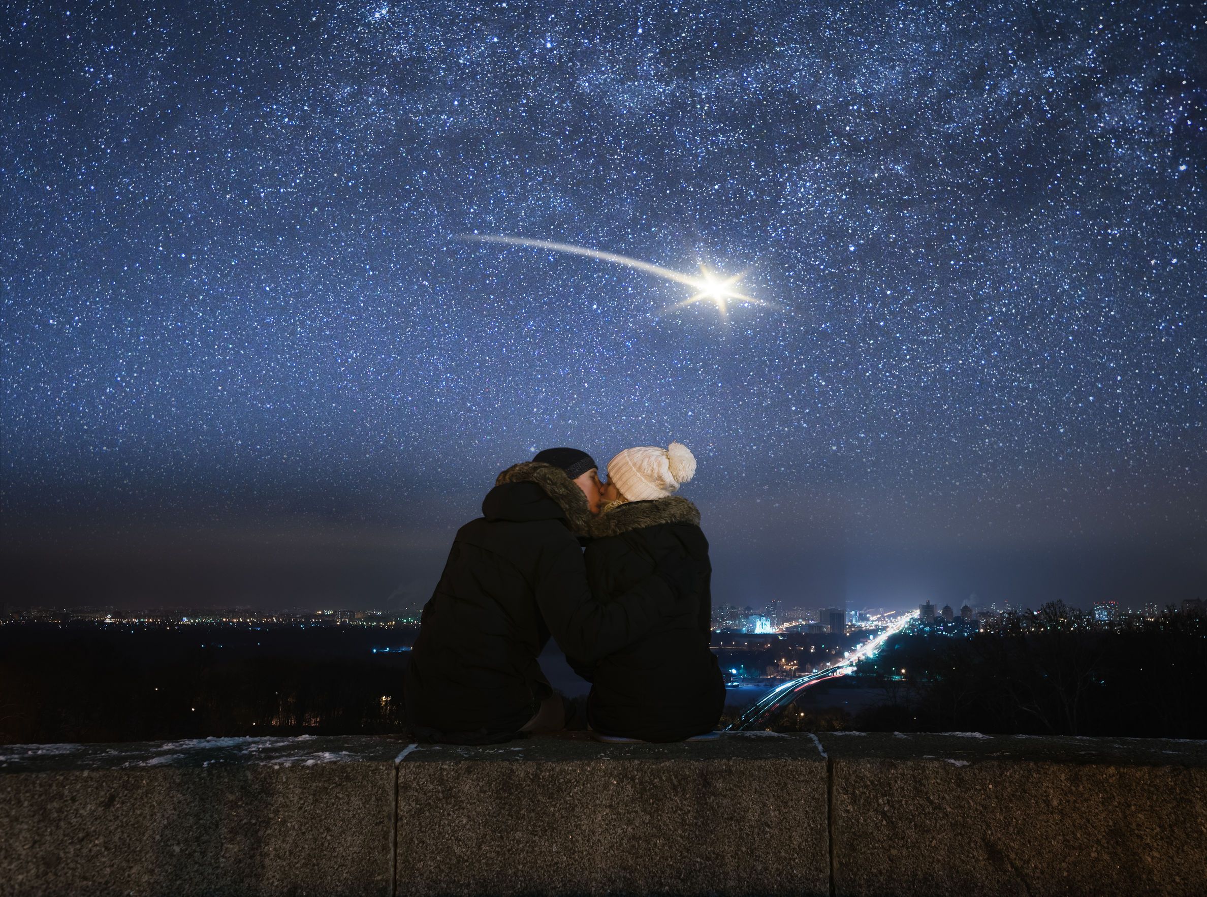 Romantic evening. Loving couple kissing. Night in city. Meteor in night sky