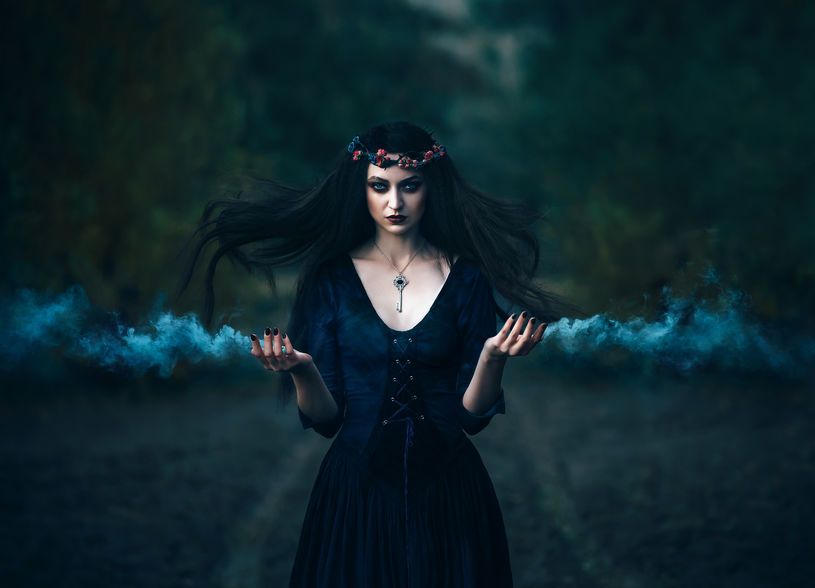 beautiful witch in forest magical spiritual