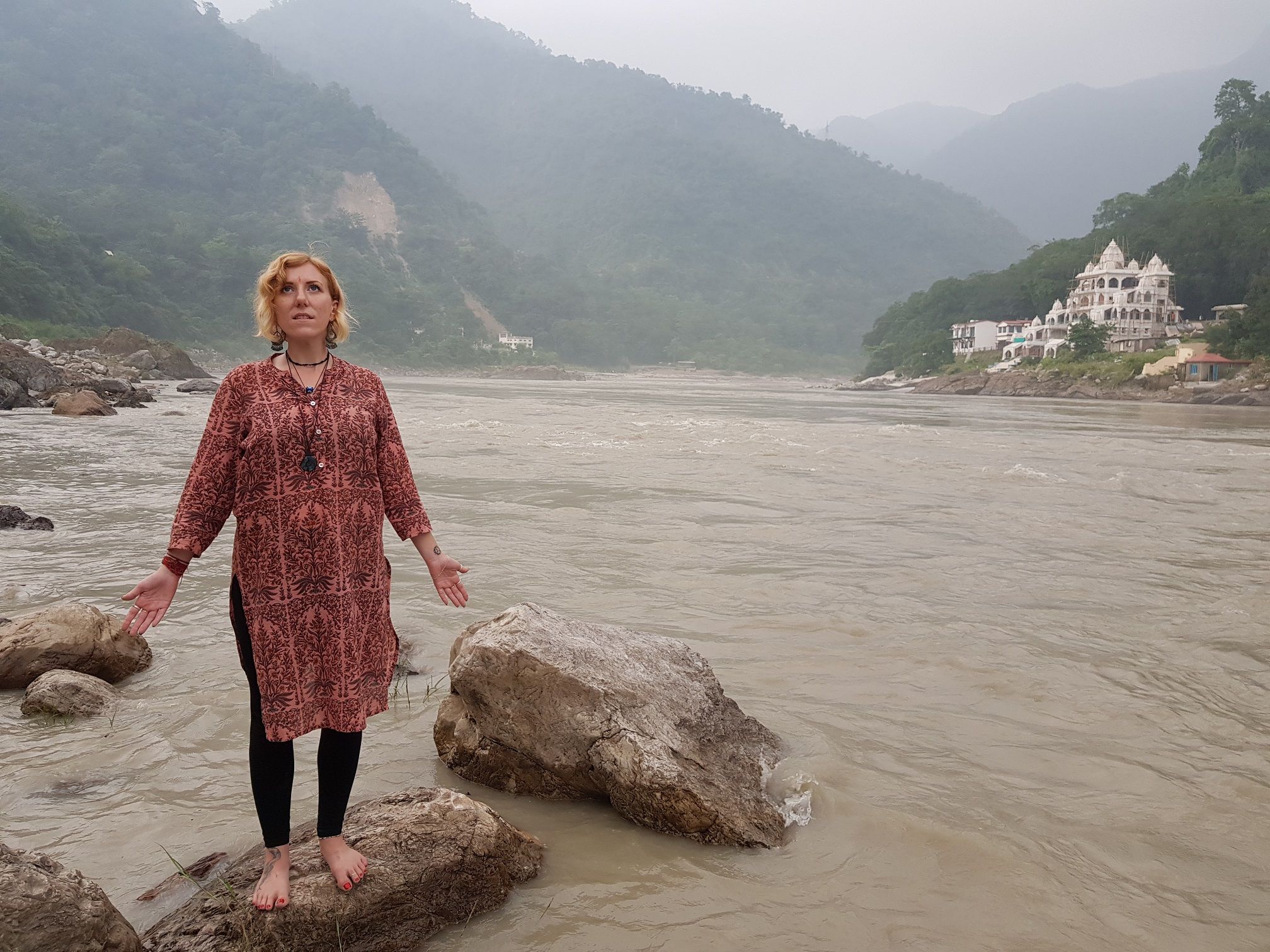 Ellie meditating near the River during her Indian Goddess Temple trek