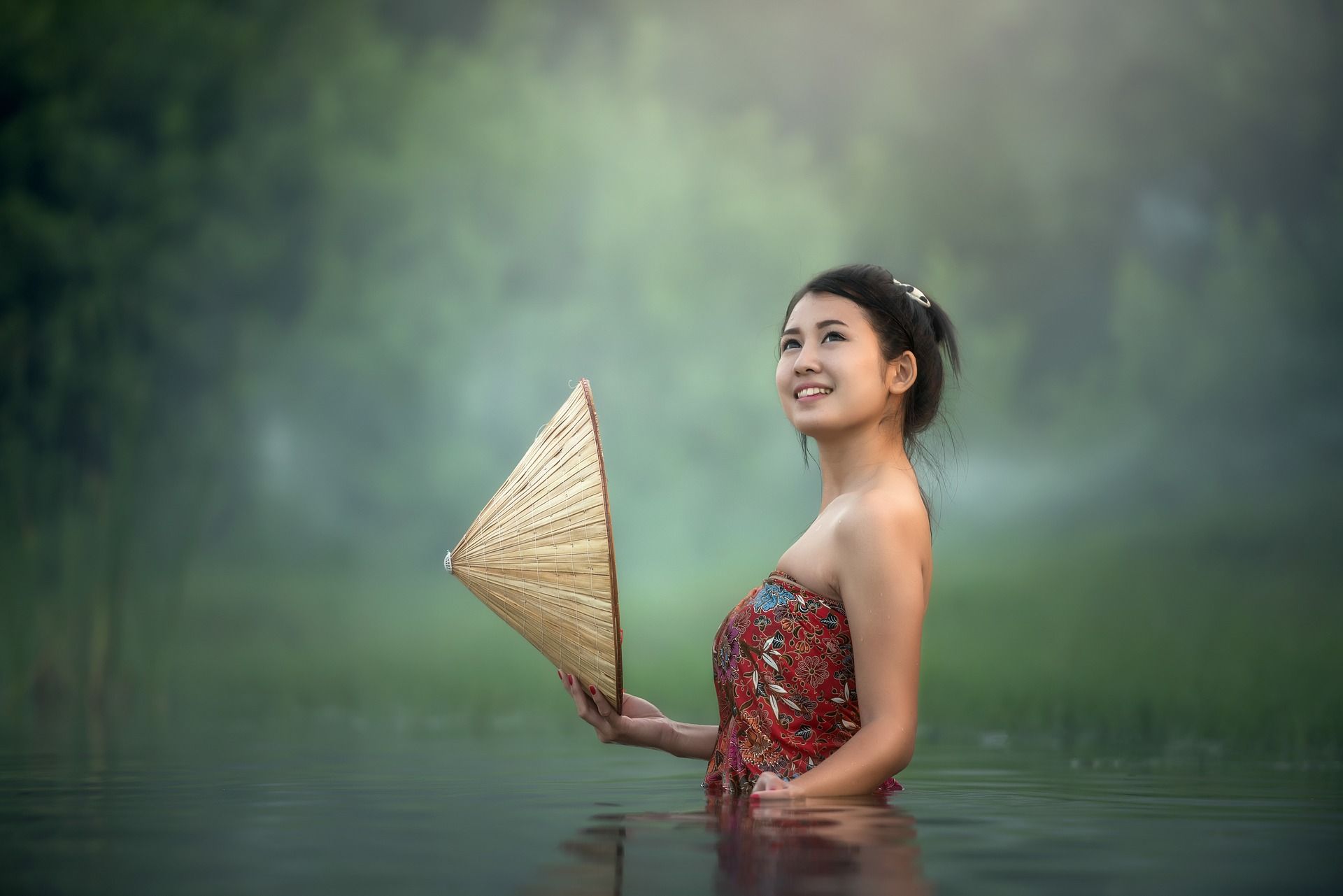 young chinese woman girl pretty smile smiling water river nature jungle green hat rain forest mystic Thailand
